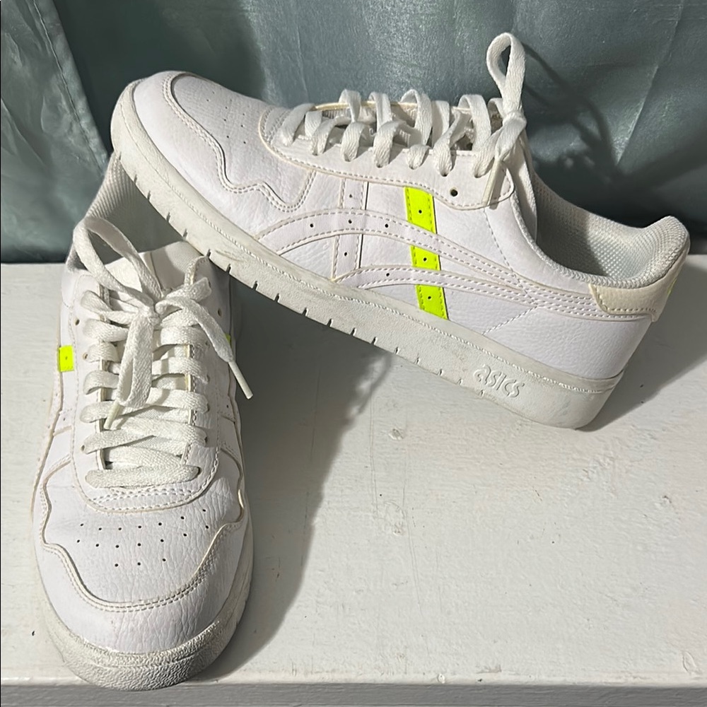 ASICS white sneaker; neon detail. Size 9
